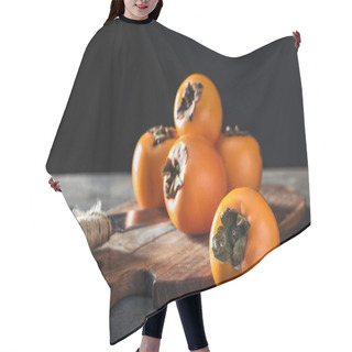 Personality  Orange Persimmons On Cutting Board With Knife Isolated On Black Hair Cutting Cape