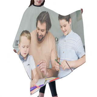 Personality  Portrait Of Father Helping Sons Draw Pictures With Colorful Pencils At Home Hair Cutting Cape