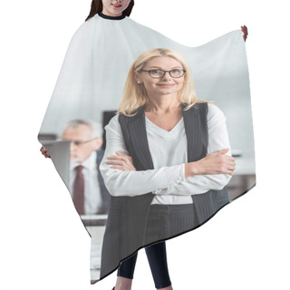 Personality  Selective Focus Of Cheerful Blonde Businesswoman In Glasses Standing With Crossed Arms Near Coworker  Hair Cutting Cape