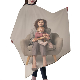 Personality  Career And Family, Balancing Work And Life Concept, Businesswoman In Suit Sitting On Armchair With Toddler Daughter, Playing With Wooden Biplane, Grey Background, Motherhood, Full Length  Hair Cutting Cape