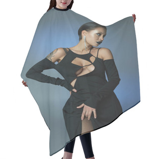 Personality  Tattooed Woman In Sexy Halloween Dress And Dark Makeup Posing With Hand On Hip On Blue Grey Backdrop Hair Cutting Cape