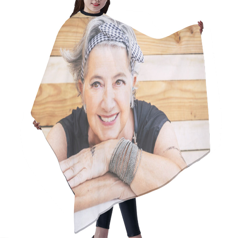 Personality  Portrait Of Cheerful Caucasian Senior Happy Woman With Wood Background - Alternative And Young Old Female Smile And Enjoy - Tatooed Skin For Diversity Concept And Age - Youthful Lifestyle Hair Cutting Cape