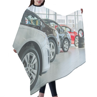 Personality  Several New Cars At Dealership Salon. Hair Cutting Cape