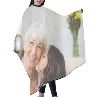 Personality  Granddaughter Kissing Grandmother On Cheek In Living Room Hair Cutting Cape