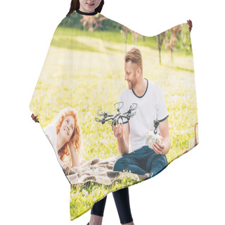 Personality  Happy Redhead Couple Playing With Drone At Picnic In Park Hair Cutting Cape