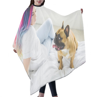 Personality  Beautiful Girl With Colorful Hair Whistling And Looking At French Bulldog While Sitting On Bed  Hair Cutting Cape
