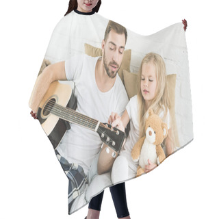 Personality  Father And Cute Little Daughter With Teddy Bear Looking At Acoustic Guitar On Bed  Hair Cutting Cape
