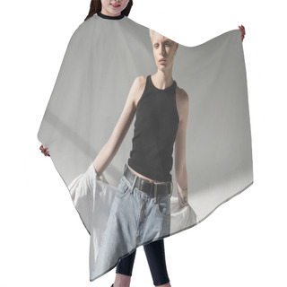 Personality  Tattooed Albino Woman In Black Tank Top And Jeans Taking Off White Shirt On Grey Background Hair Cutting Cape