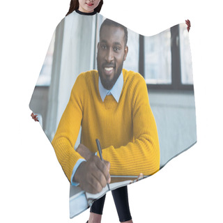 Personality  Smiling African American Businessman Holding Pen And Looking At Camera In Office Hair Cutting Cape