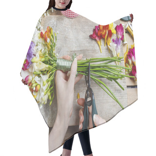 Personality  Florist At Work. Woman Making Bouquet Of Spring Freesia Flowers Hair Cutting Cape