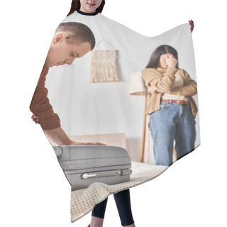 Personality  Young Man Packing Suitcase Near Depressed Asian Woman Crying In Bedroom At Home, Family Divorce Hair Cutting Cape