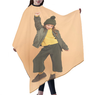 Personality  Full Length View Of Child In Fashionable Autumn Outfit Posing With Raised Hand On Beige Hair Cutting Cape