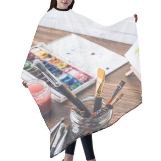 Personality  Selective Focus Of Watercolor Paints And Paintbrushes At Designer Workplace Hair Cutting Cape