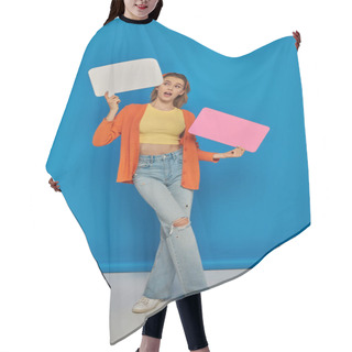 Personality  Astonished Young Woman In Casual Attire Holding Speech Bubbles On Blue Background, Space For Text Hair Cutting Cape