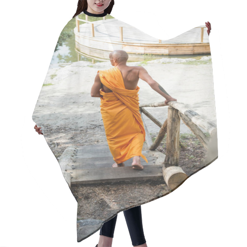 Personality  Back View Of Hairless Man In Traditional Buddhist Clothes Walking On Wooden Stairs In Forest Hair Cutting Cape