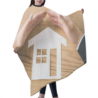 Personality  Partial View Of Business People Covering House Paper Model On Wooden Tabletop With Hands, Insurance Concept Hair Cutting Cape