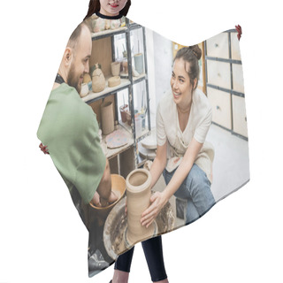 Personality  Smiling Craftswoman Shaping Clay Vase On Pottery Wheel Near Boyfriend And Bowl With Water In Studio Hair Cutting Cape
