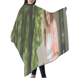 Personality  Cheerful Woman Smiling While Waving Hand During Video Call On Laptop In Green Park, Banner  Hair Cutting Cape
