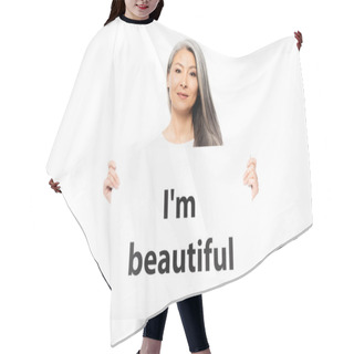 Personality  Cheerful Asian Woman Holding Placard With I`m Beautiful Lettering Isolated On White  Hair Cutting Cape