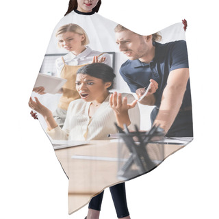 Personality  Offended Multicultural Office Workers Gesturing While Looking At Laptop At Workplace With Blurred Pens Holder On Foreground Hair Cutting Cape