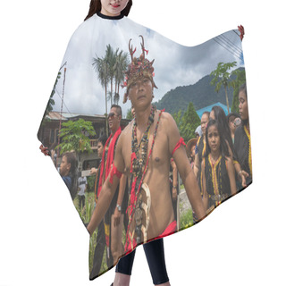 Personality  SARAWAK, MALAYSIA: JUNE 1, 2014: People Of The Bidayuh Tribe, An Indigenous Native People Of Borneo, In Traditional Costumes, Take Part In A Street Parade To Celebrate The Gawai Dayak Festival. Hair Cutting Cape