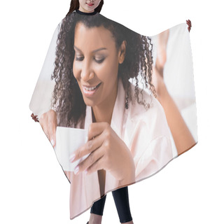 Personality  Positive African American Woman Looking At Cup Of Coffee In Bedroom  Hair Cutting Cape