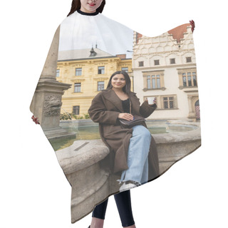 Personality  Happy Traveler In Coat Holding Paper Cup Near Ancient Fountain In Charles Square In Prague  Hair Cutting Cape