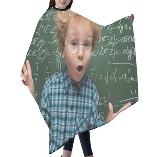 Personality  Surprised Kid In Glasses Looking At Camera Near Chalkboard With Mathematical Formulas  Hair Cutting Cape