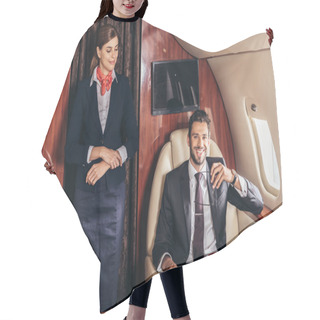 Personality  Flight Attendant In Uniform Looking At Smiling Businessman In Private Plane  Hair Cutting Cape