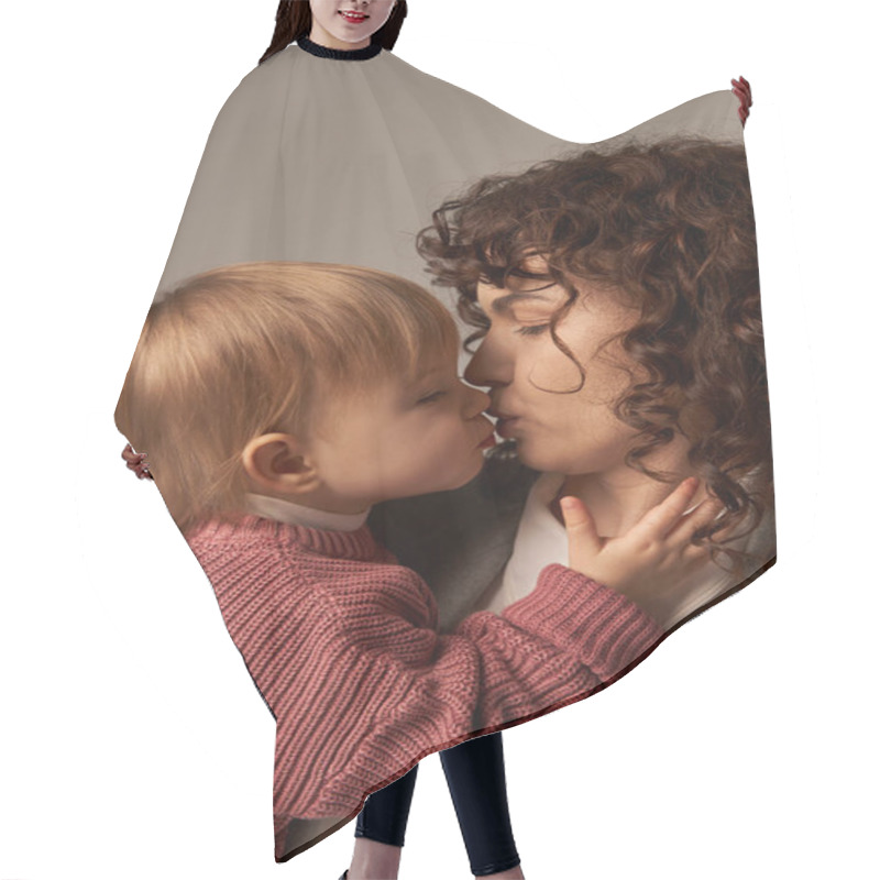Personality  Toddler Baby Girl Kissing Mom In Suit, Bonding Between Mother And Daughter, Balancing Work And Life, Career And Family, Grey Background, Love And Tenderness  Hair Cutting Cape