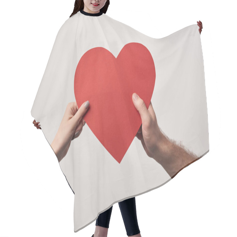 Personality  partial view of couple holding together blank heart card isolated on grey hair cutting cape