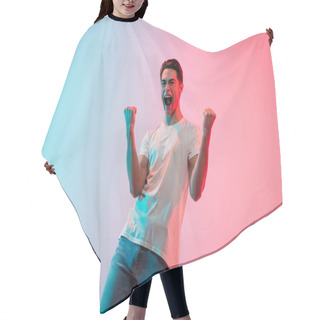 Personality  Young Caucasian Mans Portrait On Gradient Blue-pink Studio Background In Neon Light Hair Cutting Cape