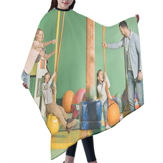 Personality  Happy Parents Looking At Kids Swinging On Swings In Entertainment Center  Hair Cutting Cape