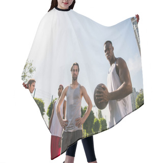 Personality  Low Angle View Of Interracial Basketball Players Looking At Camera Outdoors  Hair Cutting Cape