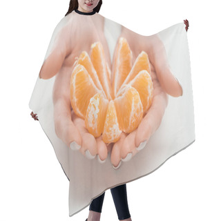 Personality  Cropped View Of Woman Holding Ripe Orange Tangerine Slices Arranged In Circle On White Background Hair Cutting Cape