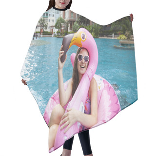 Personality  Caucasian Woman Relaxing In Swimming Pool With Pink Flamingo Inflatable Ring And Smiling On Camera  Hair Cutting Cape