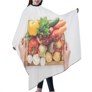 Personality  Cropped Shot Of Person Holding Box With Fresh Raw Vegetables Isolated On White  Hair Cutting Cape