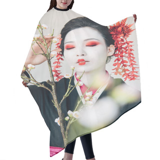 Personality  Selective Focus Of Tree Branches And Beautiful Geisha With Red And White Makeup And Closed Eyes Isolated On White Hair Cutting Cape