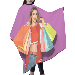 Personality  Attractive Asian Girl With Shopping Bags Holding Credit Card And Smiling At Camera Isolated On Violet Hair Cutting Cape
