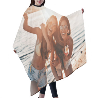 Personality  Happy Young Women Spending Carefree Time On Beach With River And Sunset  Hair Cutting Cape