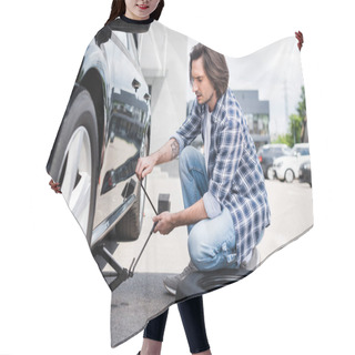 Personality  Man In Casual Wear Using Jack Tool And Changing Broken Wheel On Auto, Car Insurance Concept Hair Cutting Cape