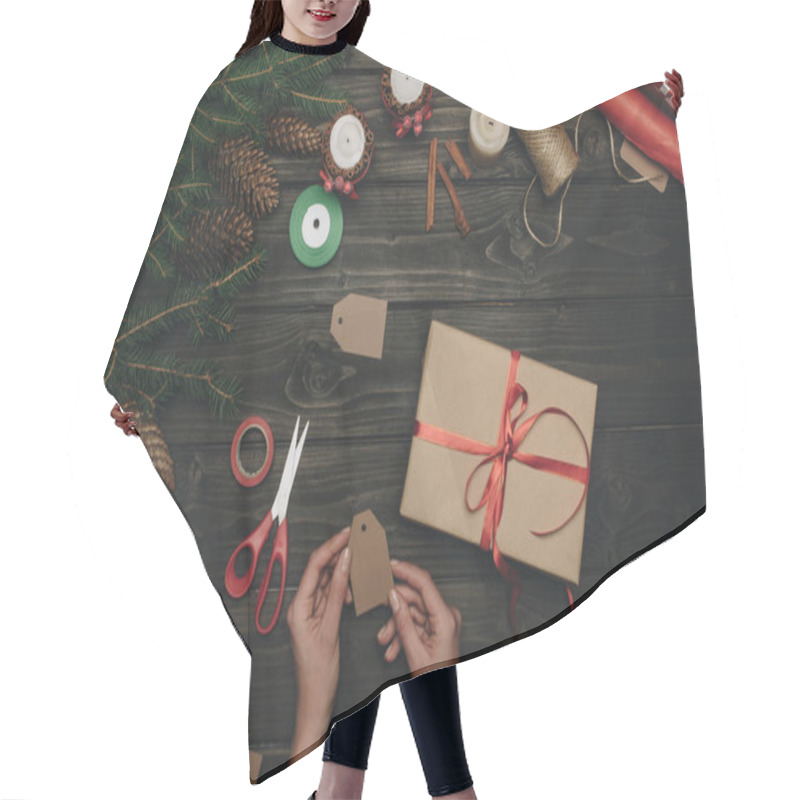 Personality  woman decorating christmas gift  hair cutting cape