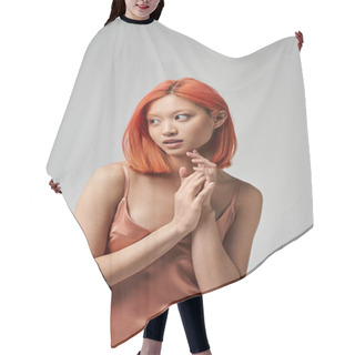 Personality  Portrait Of Dreamy Young Asian Woman With Red Hair Posing In Silk Slip Dress On Grey Background Hair Cutting Cape