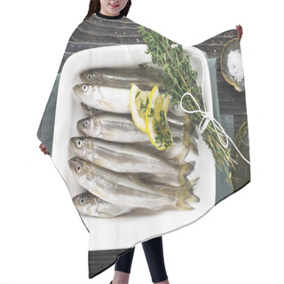 Personality  Useful Small Sea Fish. Smelt, Sardine, Anchovies Before Cooking With Salt, Lemon, Butter, Thyme On A Wooden Background. Top View. Hair Cutting Cape