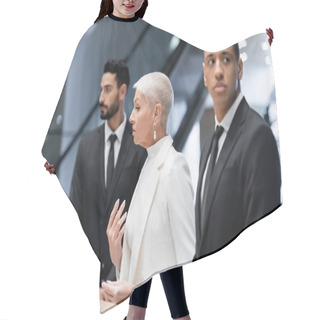 Personality  Stylish Senior Business Lady Near Hotel Reception And Private Multiethnic Bodyguards Hair Cutting Cape