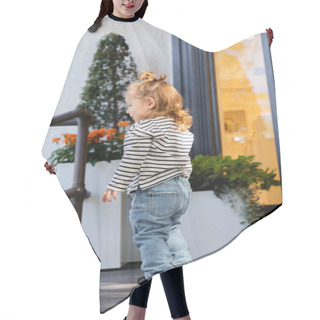 Personality  Side View Of Baby Girl In Long Sleeve Shirt And Blue Jeans Standing Near House In Miami  Hair Cutting Cape