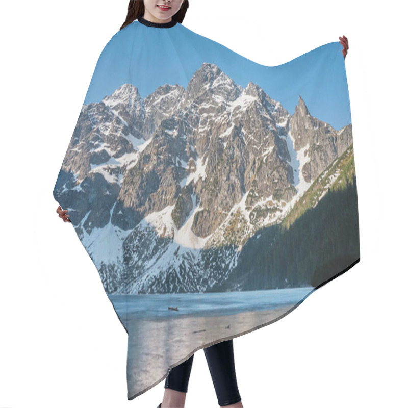 Personality  view of snow covered mountain peaks over lake water, Morskie Oko, Sea Eye, Tatra National Park, Poland hair cutting cape