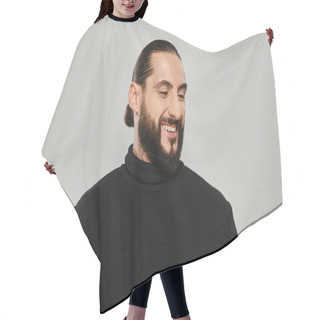 Personality  Portrait Of Good Looking Arabic Man With Beard Posing In Turtleneck And Smiling On Grey Backdrop Hair Cutting Cape