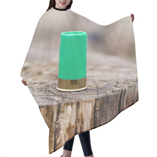 Personality  Close Up Of Shotgun Shell On Wooden Stump In Woods Hair Cutting Cape