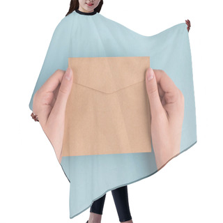 Personality  First Person People Above Top Overhead Close Up View Photo Of Female Woman Hands Holding One Envelope In Hands Isolated Over Pastel Color Blue Background Hair Cutting Cape